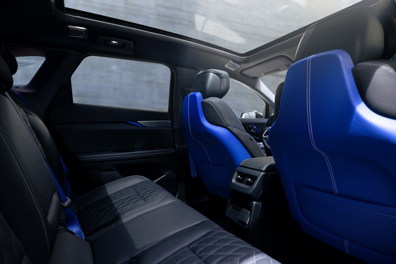 Back Seat View of the 2026 OPTIQ-V Blue Front Seats, Sun Roof, and Interior | Dutton Cadillac in RIVERSIDE CA